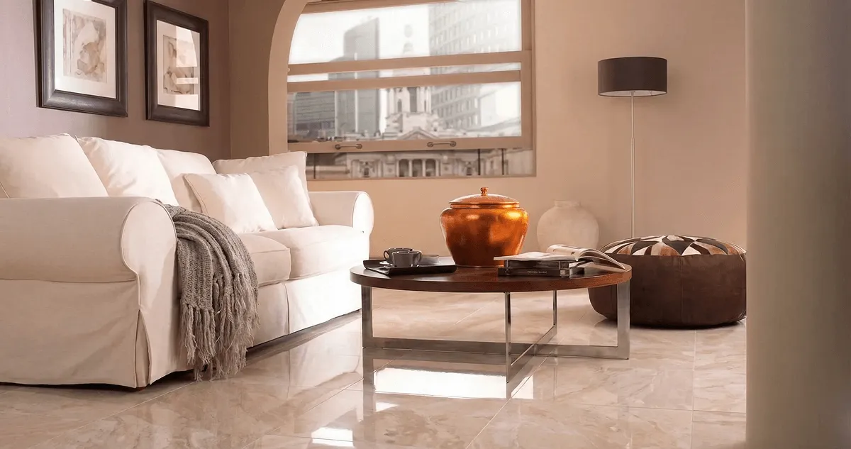 Modern living room with professionally installed marble flooring, a beige sofa, coffee table in Anchorage, AK