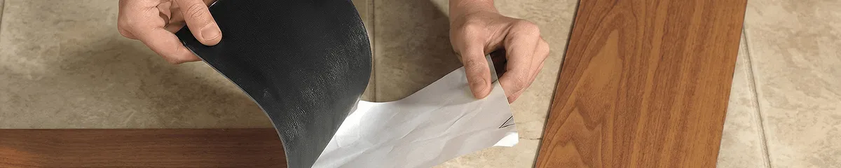 A professional installing vinyl flooring in Anchorage, AK